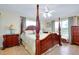 Spacious bedroom featuring a decorative four-poster bed and stylish furnishings at 13452 High Springs Ave, Port Charlotte, FL 33981