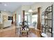 Cozy breakfast nook with a glass table, stylish chairs, and natural light streaming through the windows at 13452 High Springs Ave, Port Charlotte, FL 33981