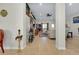 Elegant home entryway featuring tile flooring, decorative accents, and a view into the living room at 13452 High Springs Ave, Port Charlotte, FL 33981