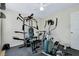 This workout room features an elliptical machine, stationary bike, weights and a multi-station weight machine at 13452 High Springs Ave, Port Charlotte, FL 33981