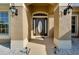 Inviting home front door with decorative glass, sidelights, and sconce lighting at 13452 High Springs Ave, Port Charlotte, FL 33981