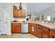 Well-equipped kitchen featuring stainless steel appliances, wooden cabinets, and neutral countertops at 13452 High Springs Ave, Port Charlotte, FL 33981