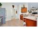Spacious kitchen features stainless steel appliances, wooden cabinets, and tiled flooring for a modern look at 13452 High Springs Ave, Port Charlotte, FL 33981