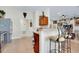 A well-equipped kitchen with stainless steel appliances, a breakfast bar, and tiled flooring for a functional space at 13452 High Springs Ave, Port Charlotte, FL 33981