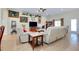 Inviting living room with comfortable seating, a large TV, and decorative accents at 13452 High Springs Ave, Port Charlotte, FL 33981