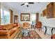 Cozy living room with comfortable seating, stylish decor, and natural light streaming through the windows at 13452 High Springs Ave, Port Charlotte, FL 33981