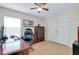Spacious office with a ceiling fan, natural light, and plenty of storage space at 13452 High Springs Ave, Port Charlotte, FL 33981