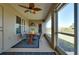 Inviting covered patio with decorative ceiling fan and furniture provides an ideal outdoor living space at 13452 High Springs Ave, Port Charlotte, FL 33981