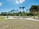Vibrant playground area with climbing structures and a basketball court for fun outdoor activities at 13452 High Springs Ave, Port Charlotte, FL 33981