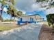 Clean public restroom facility featuring a covered area, white and blue accents, and accessible design at 13452 High Springs Ave, Port Charlotte, FL 33981