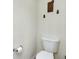 Toilet with decorations on the wall at 13452 High Springs Ave, Port Charlotte, FL 33981