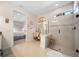 Bathroom featuring a glass shower with a mosaic tile accent and vanity area at 13897 Umbria St, Venice, FL 34293