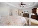Spacious bedroom featuring a tray ceiling, carpet floors, and ceiling fan at 13897 Umbria St, Venice, FL 34293