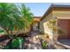 Inviting front entrance with a brick path, covered porch, and charming bench seating at 13897 Umbria St, Venice, FL 34293