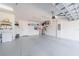 A well-organized garage with storage solutions, offering a clutter-free space for vehicles and equipment at 13897 Umbria St, Venice, FL 34293