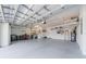A large garage with ample storage space and high ceilings, providing convenience and functionality for homeowners at 13897 Umbria St, Venice, FL 34293