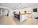 Large kitchen with island, barstool seating, and stainless steel appliances at 13897 Umbria St, Venice, FL 34293