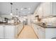 Spacious kitchen with granite countertops, stainless steel appliances, and tile flooring at 13897 Umbria St, Venice, FL 34293