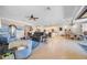 Expansive living room with an open floor plan connecting to the kitchen and dining area, ideal for entertaining at 13897 Umbria St, Venice, FL 34293