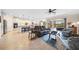 Bright and airy living room with open-concept design, seamlessly blending the living, dining, and kitchen areas at 13897 Umbria St, Venice, FL 34293