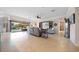 A spacious living room seamlessly extends to the outdoor patio, blurring the lines between indoor and outdoor living at 13897 Umbria St, Venice, FL 34293