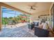 Spacious screened patio with brick flooring, outdoor seating, dining area, and serene water views at 13897 Umbria St, Venice, FL 34293