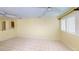 Light-filled bedroom with tile flooring, ceiling fan and window with white shutters at 1460 Everest Rd, Venice, FL 34293