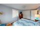 Comfortable bedroom with hardwood floors, plantation shutters, and a ceiling fan, offering style and function at 1460 Everest Rd, Venice, FL 34293
