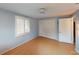 Bedroom with hardwood flooring, built in closet, a ceiling fan and natural light at 1460 Everest Rd, Venice, FL 34293