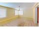 Dining room showcasing tile flooring, yellow walls, and bright, natural light at 1460 Everest Rd, Venice, FL 34293