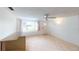 Bright living area with tile flooring, large window, and a ceiling fan at 1460 Everest Rd, Venice, FL 34293