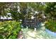The Bahia Vista Gulf bridge leads to a tranquil oasis, surrounded by lush landscaping and picturesque scenery at 1555 Tarpon Center Dr # 156, Venice, FL 34285