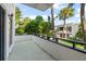 Private balcony boasting mature landscaping and beautiful blue sky views for relaxing or entertaining at 1555 Tarpon Center Dr # 156, Venice, FL 34285