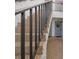 Charming stairs leading to condo units with decorative front door wreath and flower boxes at 1555 Tarpon Center Dr # 156, Venice, FL 34285