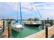 Picturesque marina featuring sailboats docked at wooden piers on a sunny day at 1555 Tarpon Center Dr # 156, Venice, FL 34285