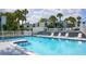 Large pool area with ample seating, ideal for relaxation and social gatherings at 1555 Tarpon Center Dr # 156, Venice, FL 34285
