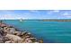 Beautiful waterfront view of the Venice, FL coast, featuring crystal clear water, rocks and distant views at 1555 Tarpon Center Dr # 156, Venice, FL 34285