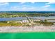 Beautiful aerial view showcases the pristine beach, bridge, and the Gulf at 1585 Keyway Ct, Englewood, FL 34223