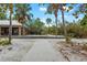 Path to beachside park featuring picnic tables and BBQ grills at 1585 Keyway Ct, Englewood, FL 34223
