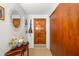 Light and airy foyer with tile flooring, storage closet, and charming decor at 1585 Keyway Ct, Englewood, FL 34223