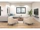 Stylish living room featuring hardwood floors, a gray sectional sofa, and a modern coffee table at 1804 Nimbus Dr, North Port, FL 34287