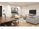Open concept living and dining space featuring hardwood floors, modern decor, and plenty of light at 1804 Nimbus Dr, North Port, FL 34287