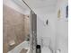 A full bathroom featuring a shower and tub at 1951 E Isles Rd, Port Charlotte, FL 33953