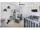 Bright Bedroom with crib, chair, and gray decor at 1951 E Isles Rd, Port Charlotte, FL 33953