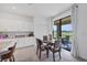 Cozy dining area bathed in natural light features a table setting and direct access to the patio at 1951 E Isles Rd, Port Charlotte, FL 33953