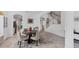 Spacious dining room area showcasing stairs, tile floors and an open floor plan at 1951 E Isles Rd, Port Charlotte, FL 33953