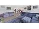 Open-plan living area with a view of the kitchen and comfortable sofa and area rug at 1951 E Isles Rd, Port Charlotte, FL 33953