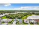 Aerial shot showing the community with serene lakes, lush green spaces, and attractive housing developments at 19825 Bridgetown Loop, Venice, FL 34293