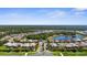 Residential area showing the community's layout, serene lakes, and landscaped green spaces with clear blue skies at 19825 Bridgetown Loop, Venice, FL 34293