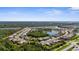 Overview of community featuring multiple lakes, lush green spaces, and well-maintained residences at 19825 Bridgetown Loop, Venice, FL 34293